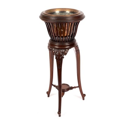 Lot 553 - An Edwardian mahogany slatted jardinière stand...