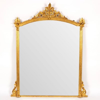 Lot 555 - An arch-top gilded overmantel mirror with...