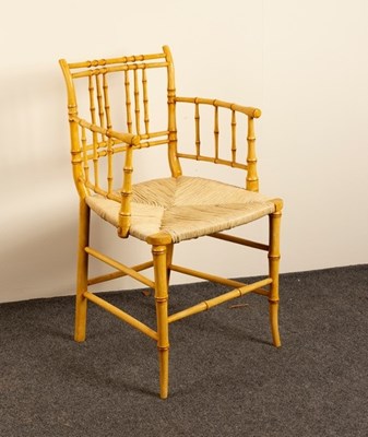 Lot 586 - A late Regency simulated bamboo armchair with...