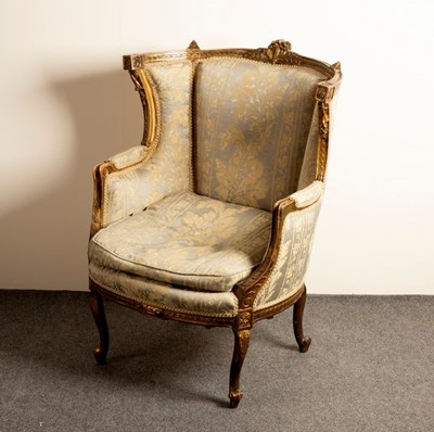 Lot 589 - A Louis XV style fauteuil with carved and...