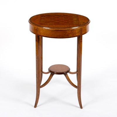 Lot 598 - An Edwardian burr elm circular table, inlaid...