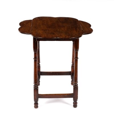 Lot 623 - A George III mahogany two-flap octofoil table...