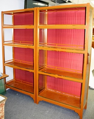 Lot 628 - A pair of brown painted and gilded display...