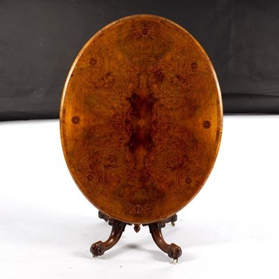 Lot 634 - A Victorian walnut and inlaid breakfast table,...