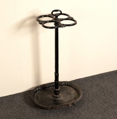 Lot 645 - A cast iron stick stand, the four apertures to...