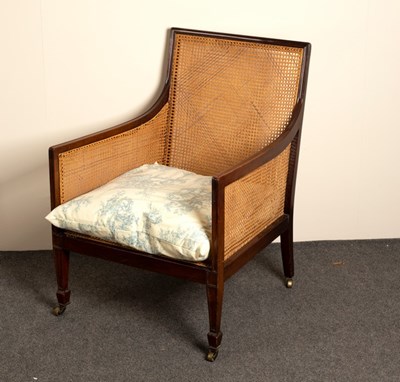 Lot 659 - A Regency mahogany framed bergère chair with...