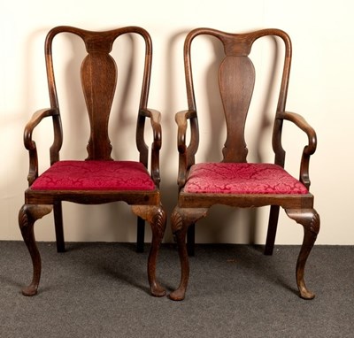 Lot 667 - A pair of oak armchairs of George I design...