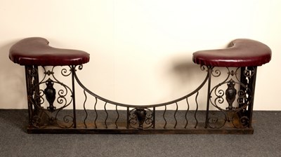 Lot 671 - A wrought iron club fender with down swept...