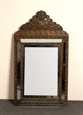 Lot 676 - A French wall mirror with repoussé frame and...