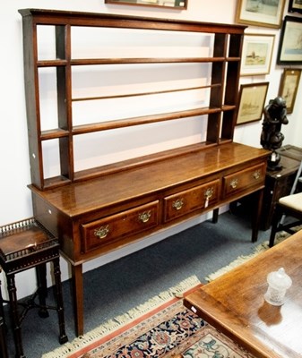 Lot 684 - An 18th Century oak and crossbanded dresser...