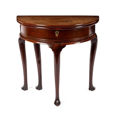 Lot 713 - A George II walnut half-round tea table, on...