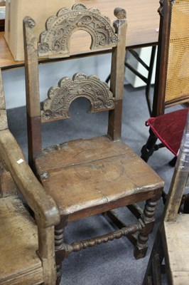 Lot 717 - A 17th Century oak single chair with foliate...