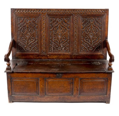 Lot 721 - An early 18th Century carved oak settle, the...