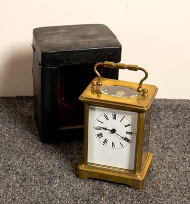 Lot 754 - A gilt brass cased carriage clock, the white...