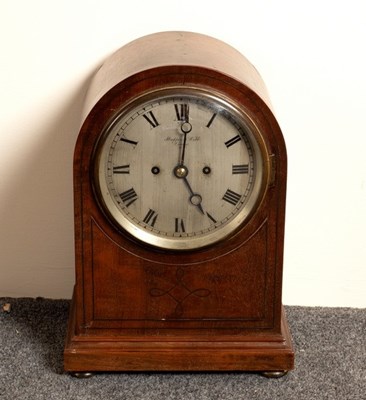 Lot 755 - An arch-top mantel clock, the silvered dial...