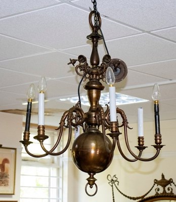 Lot 764 - A Flemish brass six-light chandelier with...