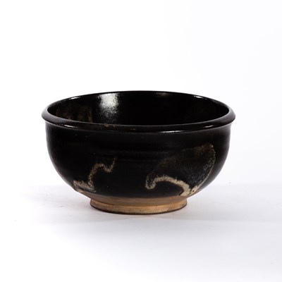 Lot 221 - Studio Pottery, a black glaze bowl with pale...