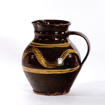 Lot 319 - Michael Cardew, Winchcombe Pottery, a slipware...