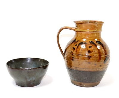 Lot 331 - Sidney Tustin, a slipware jug decorated rust...