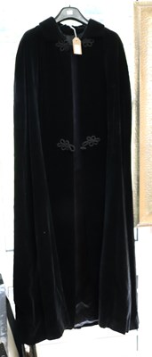 Lot 558 - Raymond of London, a black velvet cloak with...