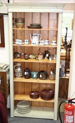 Lot 588 - A pair of painted open cabinets, fitted...