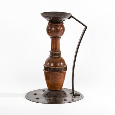 Lot 599 - A Jugendstil copper and wood candlestick by...