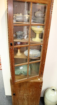 Lot 612 - An Art Deco style limed oak display cabinet...