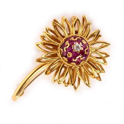 Lot 28 - A ruby and diamond flower brooch by Kutchinsky,...