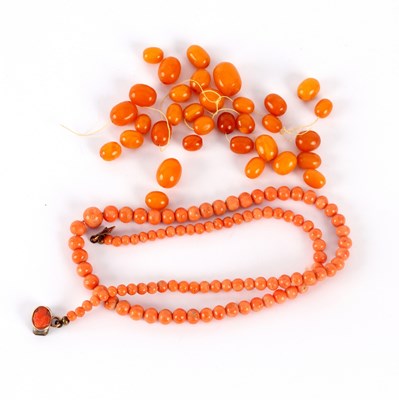 Lot 29 - A coral bead necklace, the graduated beads to...