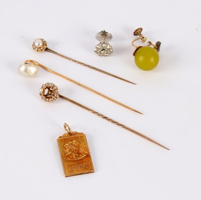 Lot 34 - A diamond and pearl stick pin with cluster...