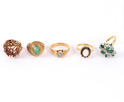 Lot 38 - Five dress rings including a ruby set example...