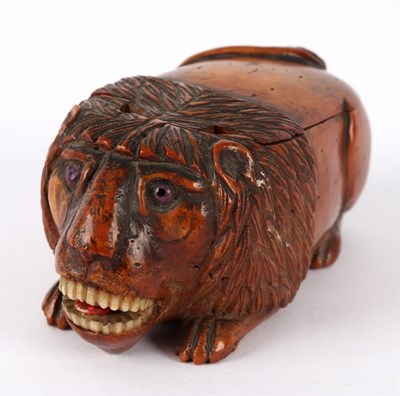 Lot 57 - A coquilla nut lion snuff box, circa 1800,...