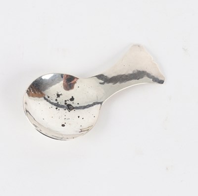 Lot 103 - An Arts & Crafts silver caddy spoon, Guild of...