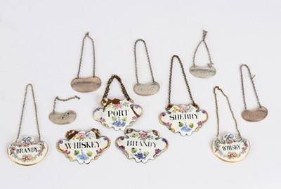 Lot 104 - A set of four enamelled decanter labels for...