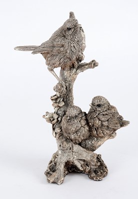 Lot 106 - A filled silver model of three birds on a...