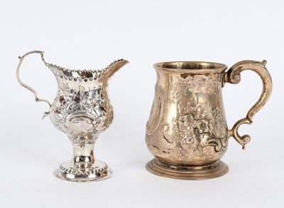 Lot 109 - A George III silver embossed jug, London 1771,...