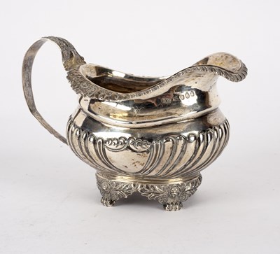 Lot 135 - A silver cream jug, WH, London 1820, of...