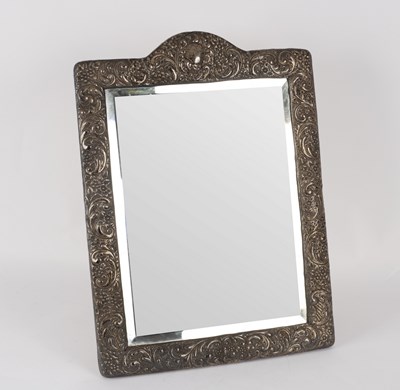 Lot 137 - An embossed silver framed mirror, Birmingham...