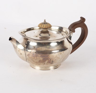 Lot 145 - A George III circular silver teapot, Robert &...