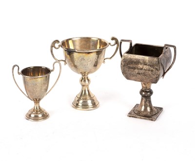 Lot 148 - Three small silver trophy cups, approximately...