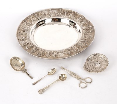 Lot 184 - An Eastern white metal dish with figures in...