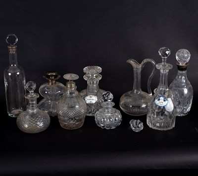 Lot 209 - A group of nine glass decanters, four with...