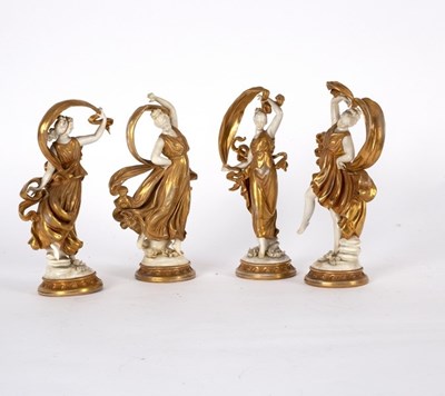 Lot 254 - A set of four porcelain figures of dancing...