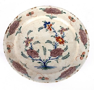 Lot 262 - A Dutch Delft polychrome plate, 31cm diameter