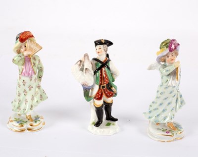 Lot 276 - A miniature Meissen figure of a gentleman with...