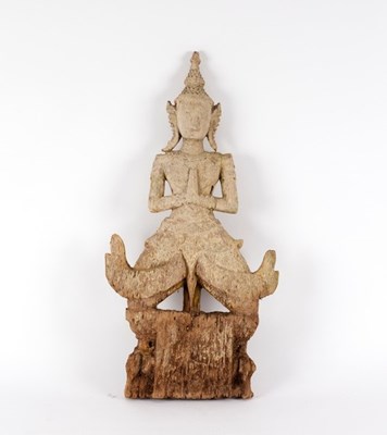 Lot 315 - A Thai carved wood wall hanging figure of...