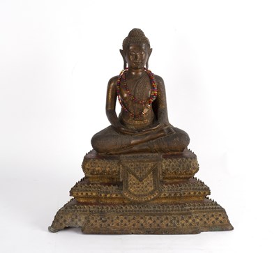 Lot 321 - A Thai metal Buddha seated cross-legged on a...