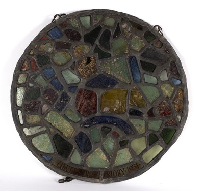 Lot 353 - A circular stained glass panel inscribed...