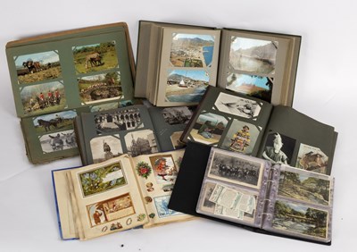 Lot 402 - A quantity of postcards contained in five...