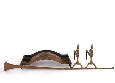 Lot 419 - A fire grate on a pair of brass andiron...